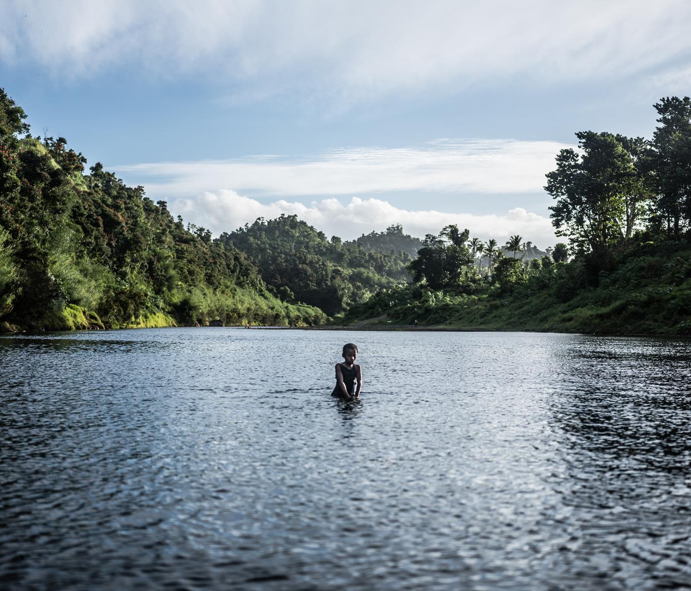 a boy in a lake